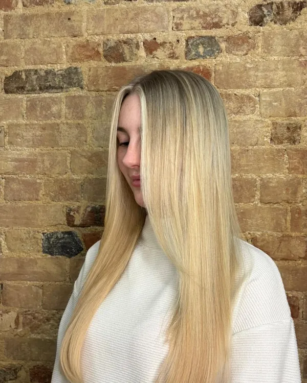 Long blonde hair finished and styled