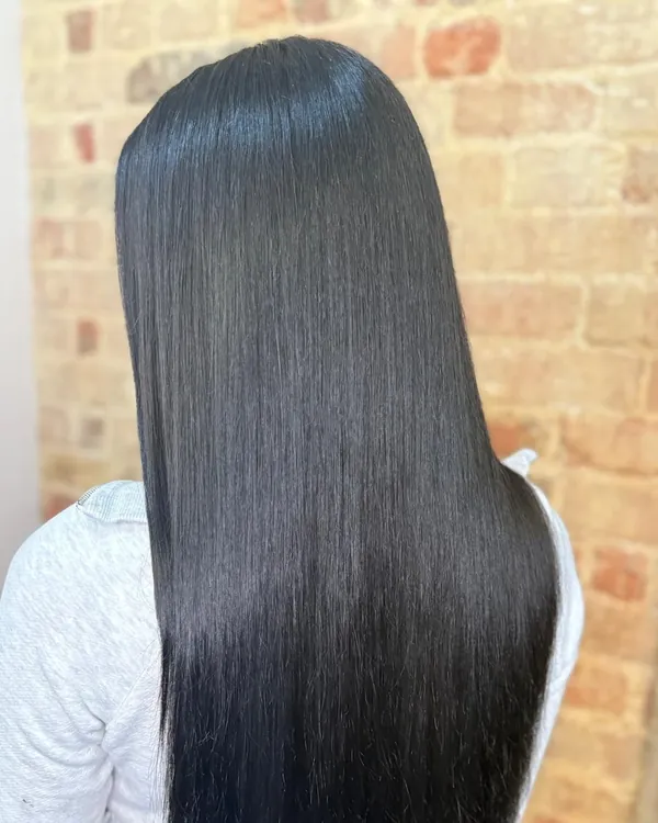 Long, glossy straight dark hair from behind