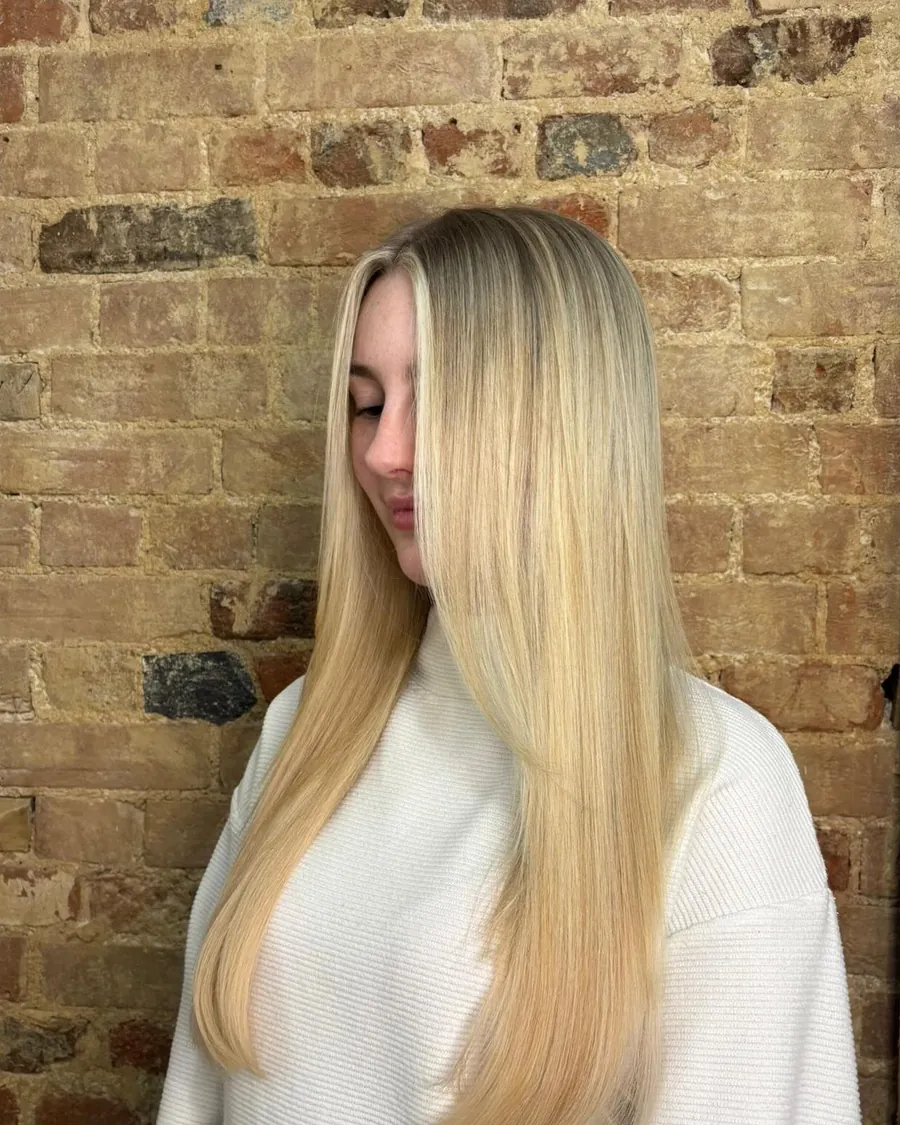 Long, bright blonde hair finished straight and smooth